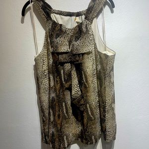 Beautiful animal print top with very cute and flattering ruffles on top.